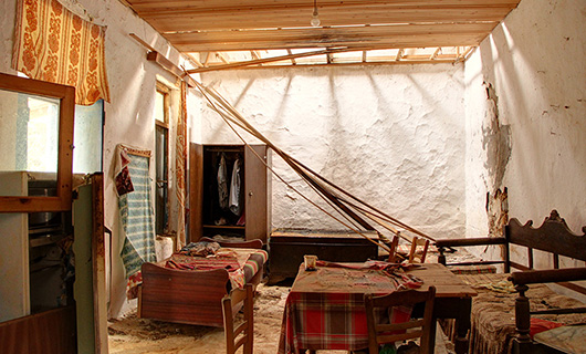 OLD STONE HOUSE WITH AN AGED OLIVE GROVE