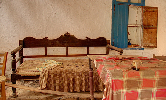 OLD STONE HOUSE WITH AN AGED OLIVE GROVE