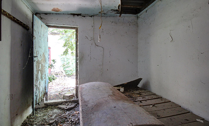 FARM HOUSE IN AN ABANDONED NEIGHBORHOOD