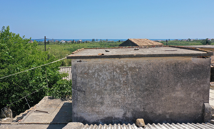 IN AN ABANDONED NEIGHBORHOOD NEAR THE SEA