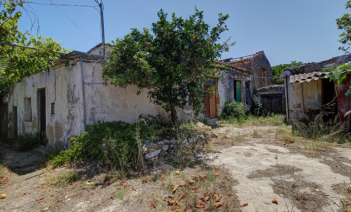 IN AN ABANDONED NEIGHBORHOOD NEAR THE SEA