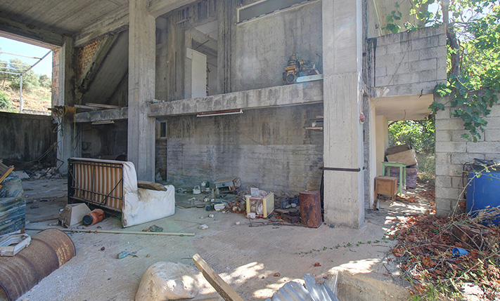 UNFINISHED MIXED-USE BUILDING WITH POTENTIAL