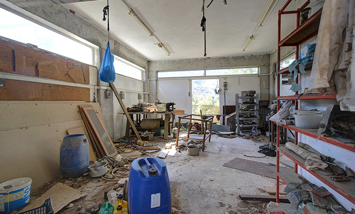 UNFINISHED MIXED-USE BUILDING WITH POTENTIAL