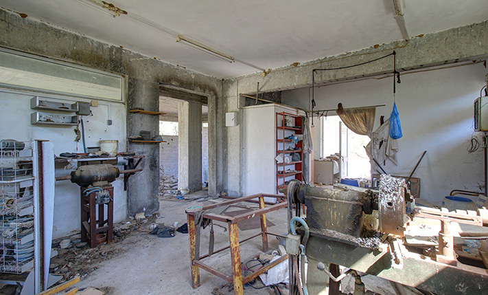 UNFINISHED MIXED-USE BUILDING WITH POTENTIAL