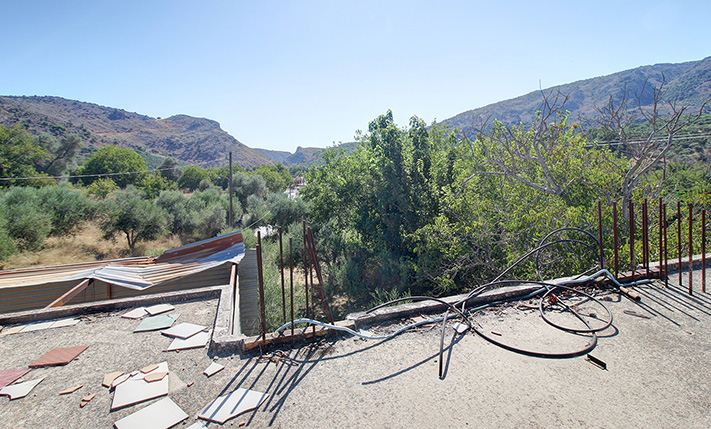 UNFINISHED MIXED-USE BUILDING WITH POTENTIAL