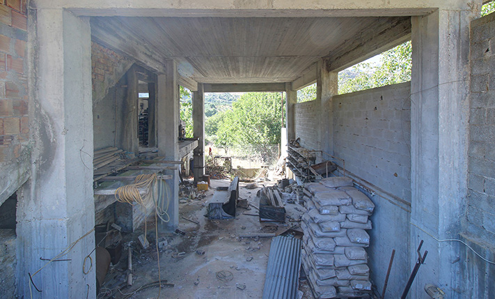 UNFINISHED MIXED-USE BUILDING WITH POTENTIAL