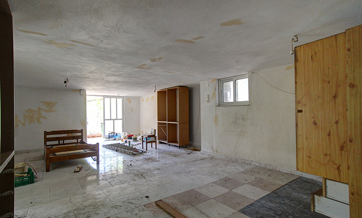 UNFINISHED MIXED-USE BUILDING WITH POTENTIAL