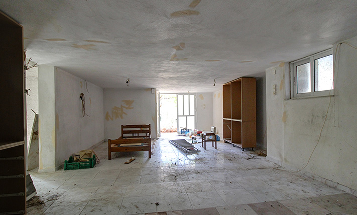 UNFINISHED MIXED-USE BUILDING WITH POTENTIAL