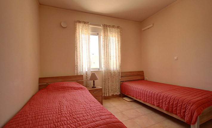 GROUND-LEVEL WITH GARDEN, STEPS FROM THE BEACH