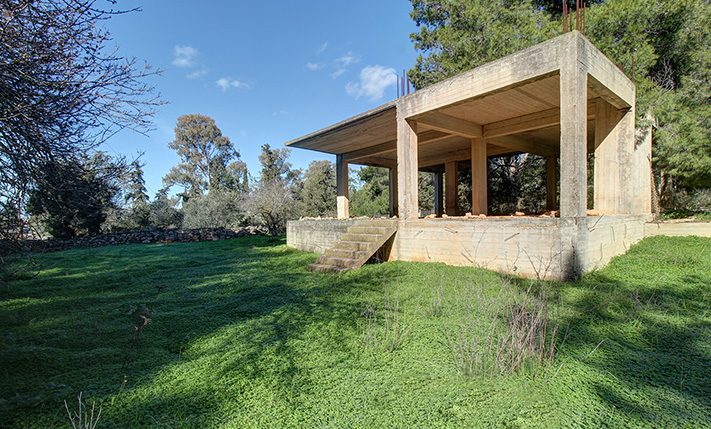 LAND FOR A SMALL COMPLEX WITH UNFINISHED HOUSE