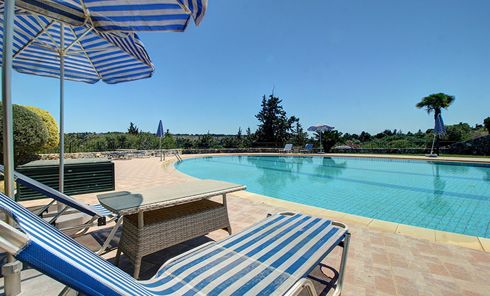 IN A LUSH COMPLEX WITH SPACIOUS SWIMMING POOLS