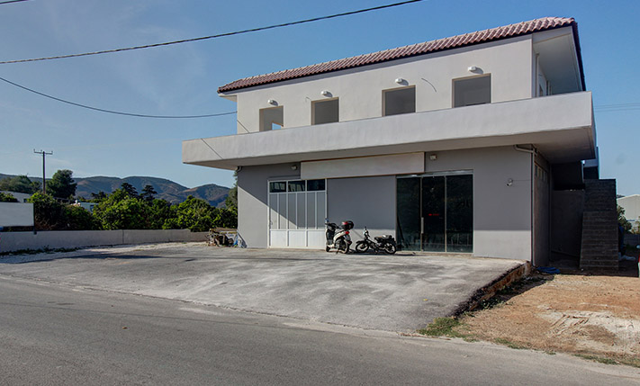 MIXED-USE BUILDING WITH RETAIL UNIT AND 2 APTS