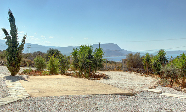 A SUN-DRENCHED HOUSE OVERLOOKING THE SEA