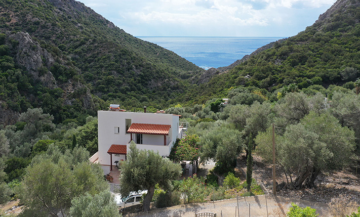 NESTLED IN A LUSH GORGE THAT MEETS THE SEA