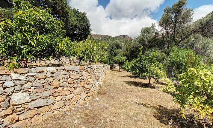 NESTLED IN A LUSH GORGE THAT MEETS THE SEA