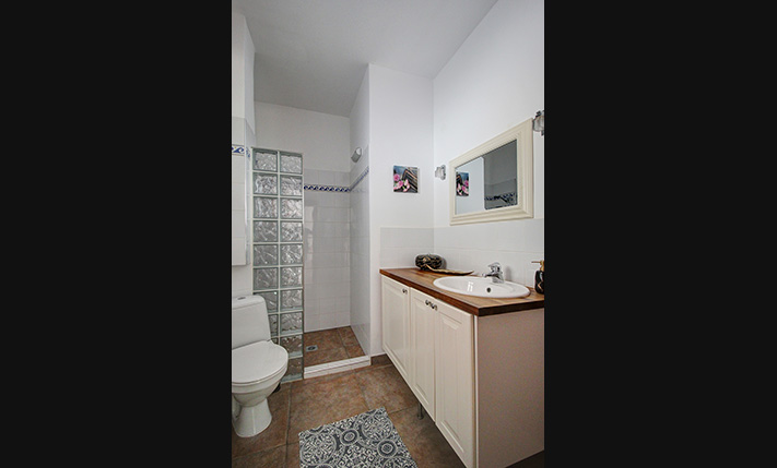 NESTLED IN A LUSH GORGE THAT MEETS THE SEA