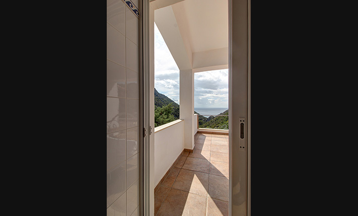 NESTLED IN A LUSH GORGE THAT MEETS THE SEA