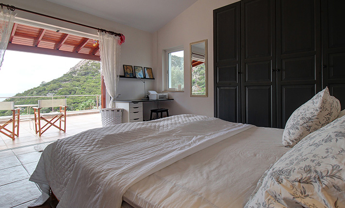 NESTLED IN A LUSH GORGE THAT MEETS THE SEA