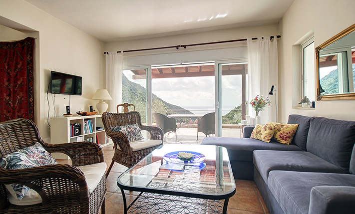 NESTLED IN A LUSH GORGE THAT MEETS THE SEA