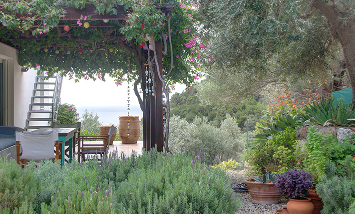 NESTLED IN A LUSH GORGE THAT MEETS THE SEA