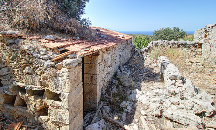 AN OLD FARMER'S STONE COMPLEX WITH SEA VIEWS